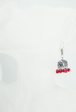 Black metal earrings with red beads - Desi Royale