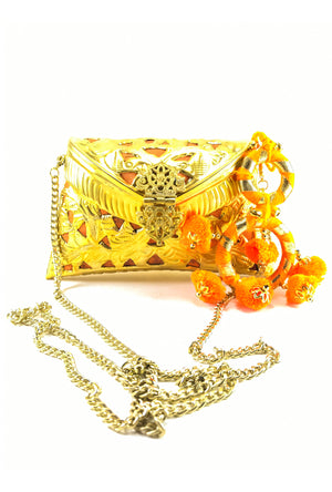 Gold Metal Clutch with orange Tassels - Desi Royale